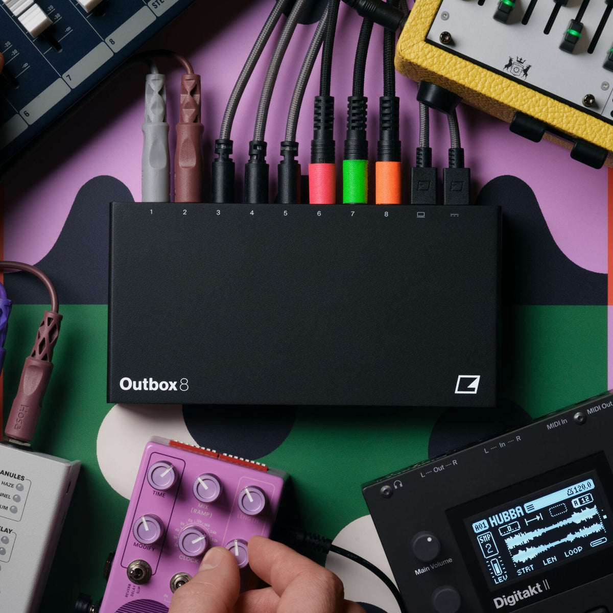 Elektron Outbox 8 patched on a studio desk beside an Elektron Digitakt II