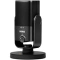 Rode NT-USB Mini USB microphone on a desk with a stand and connected to a laptop, ideal for podcasting and streaming.