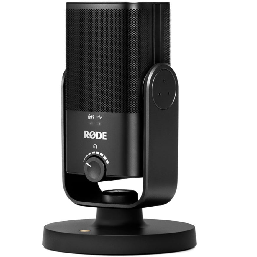 Rode NT-USB Mini USB microphone on a desk with a stand and connected to a laptop, ideal for podcasting and streaming.