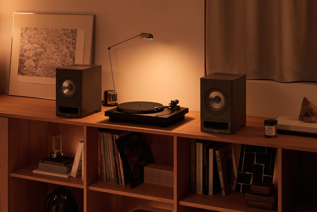 Technics SL-40CBT turntable with a sleek black finish, featuring tonearm and platter for high-quality vinyl playback.