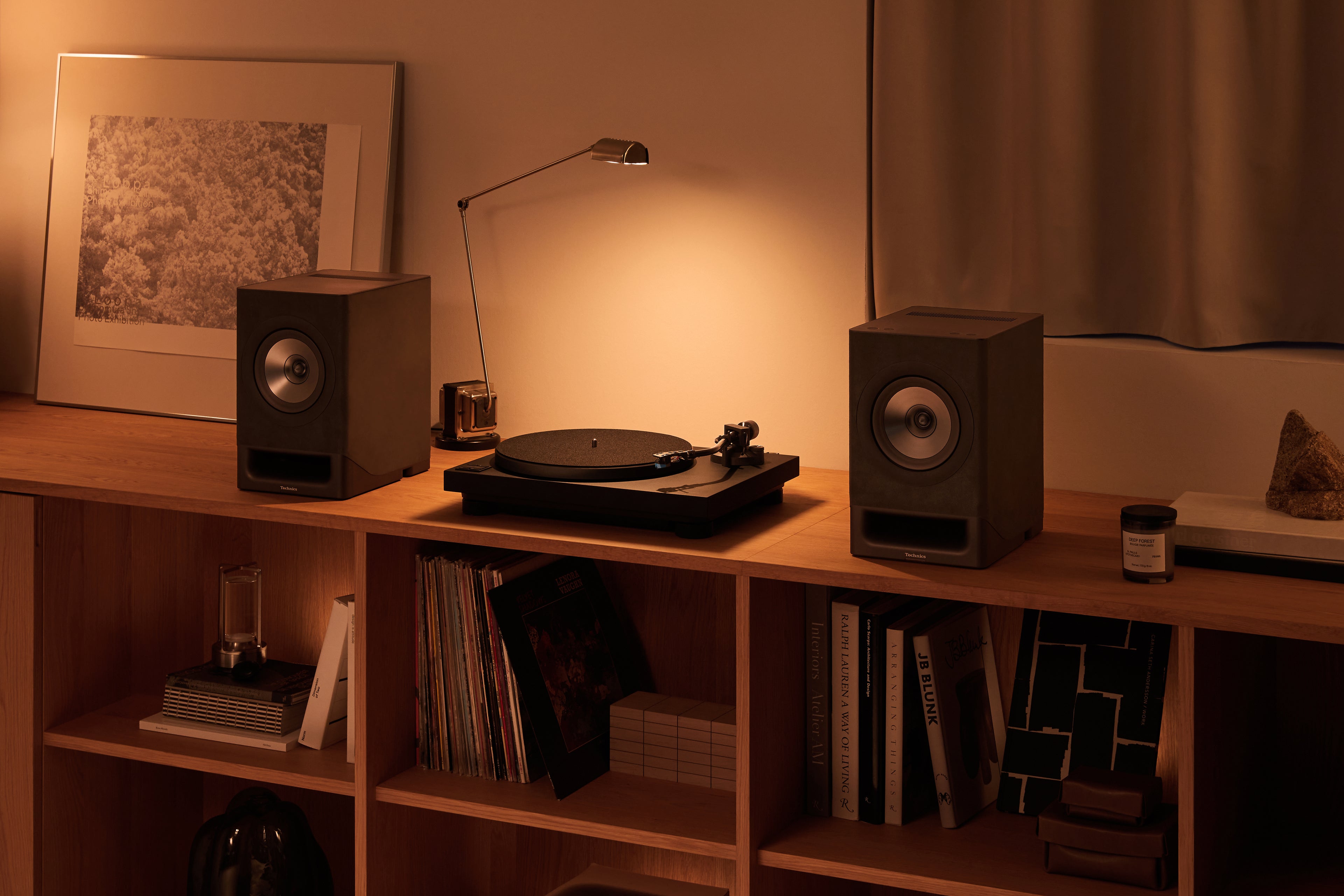 Technics SL-40CBT turntable with a sleek black finish, featuring tonearm and platter for high-quality vinyl playback.