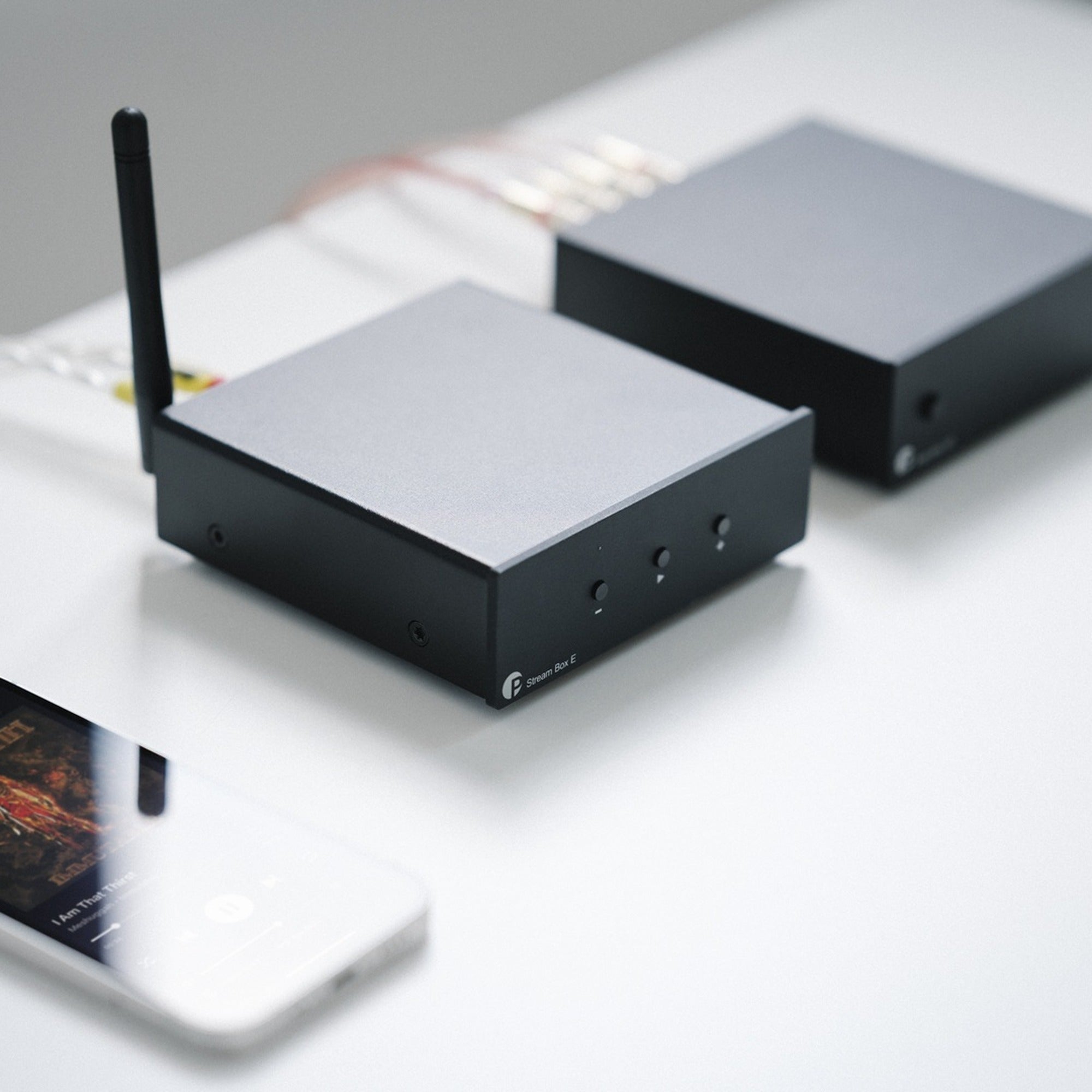 Pro-Ject Stream Box E music streamer connected to audio equipment in a modern home setting