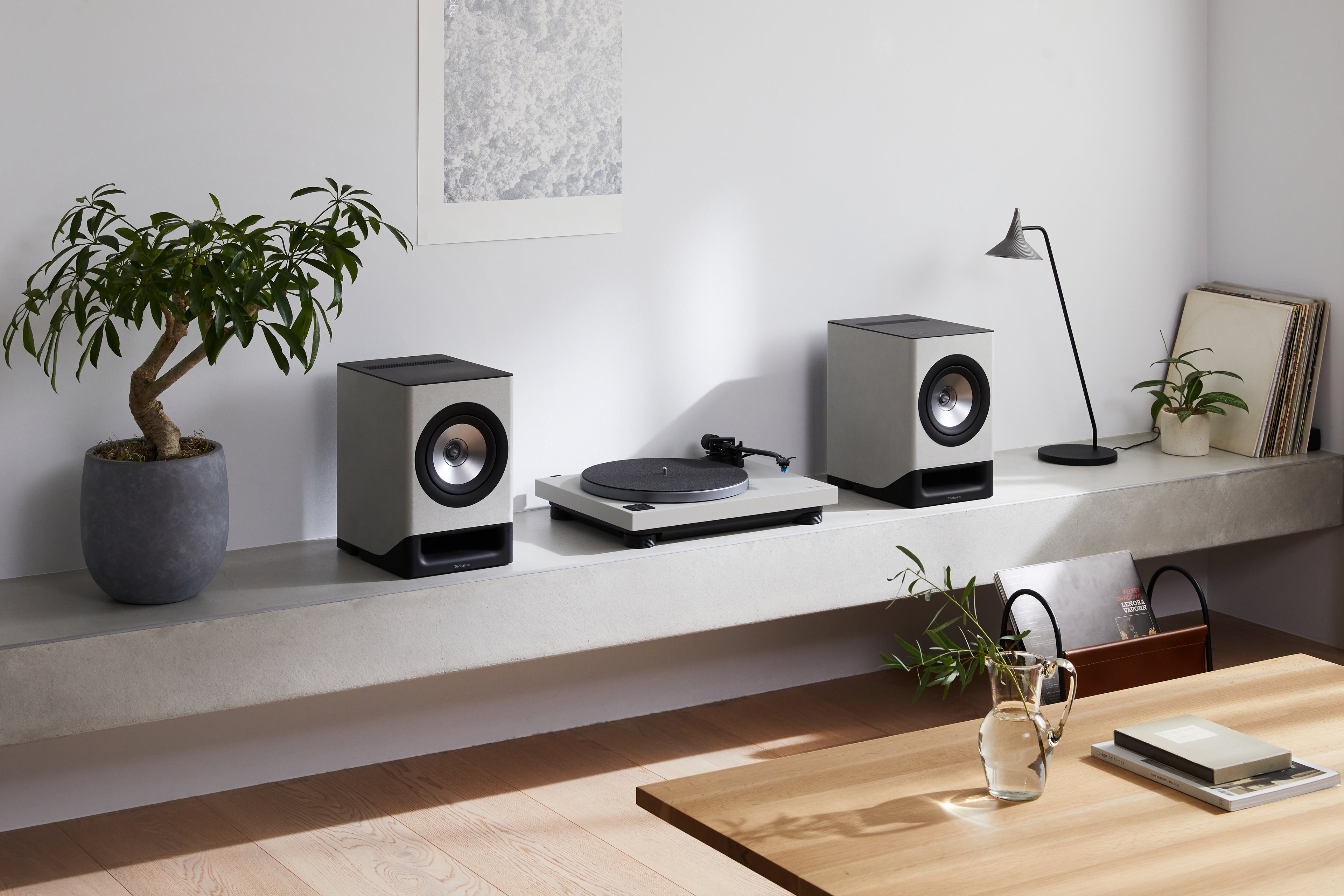 Technics SL-40CBT turntable with black finish, featuring tonearm and platter, designed for high-quality vinyl playback.