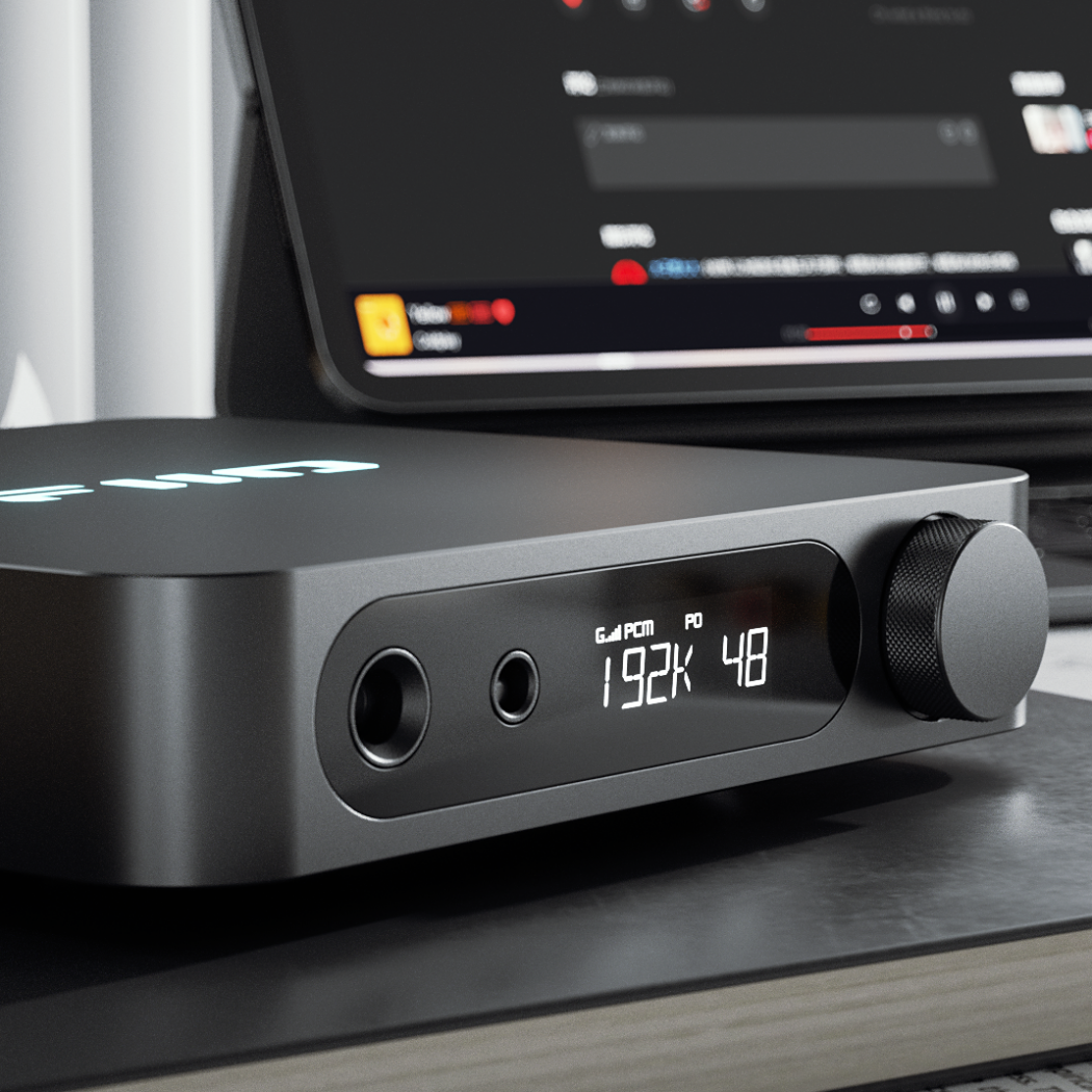 FiiO K11 headphone amplifier and DAC with sleek black design, multiple input options, and a compact desktop setup.