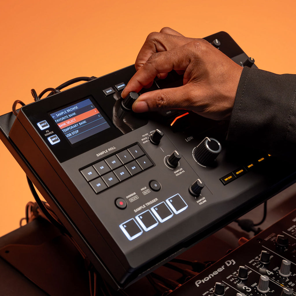 AlphaTheta RMX-IGNITE DJ effects processor displaying a vibrant multi-color screen with various controls and visual effects.