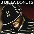Black vinyl 2LP of J Dilla's Donuts album, featuring hip-hop and rap artwork, released by Stones Throw Records.