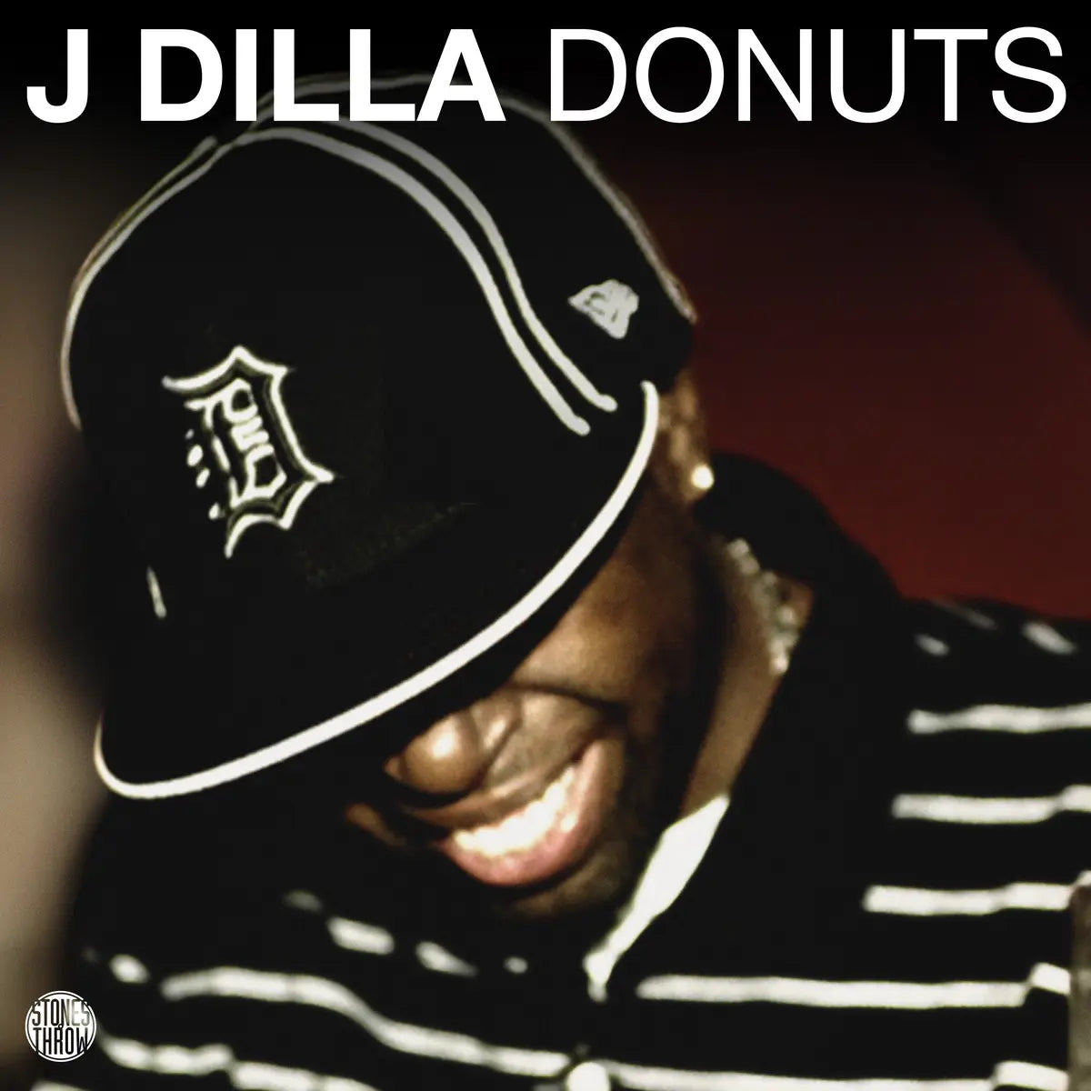 Black vinyl 2LP of J Dilla's Donuts album, featuring hip-hop and rap artwork, released by Stones Throw Records.