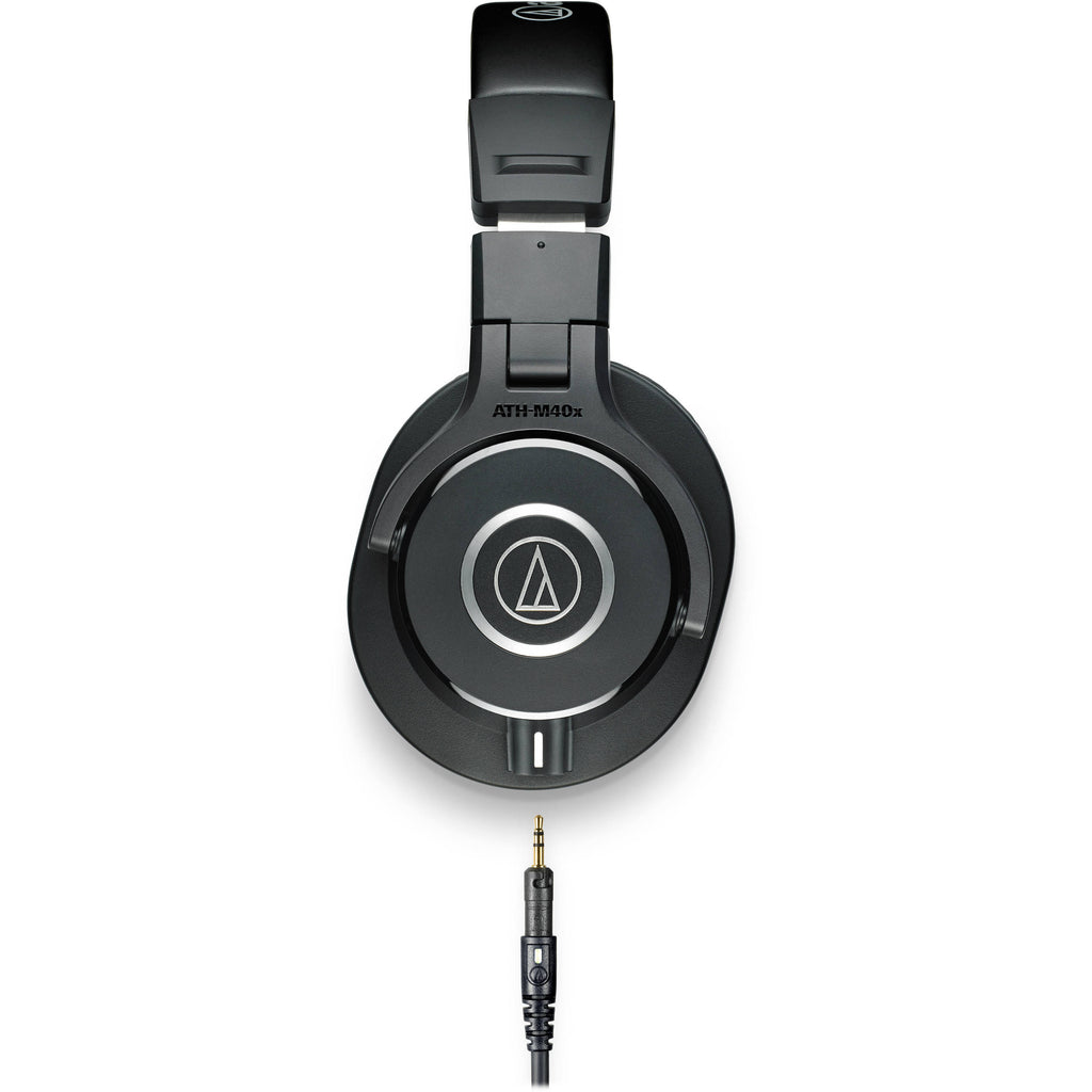 Audio Technica ATH-M40x studio headphones with over-ear design and adjustable headband, shown in black on a plain background.