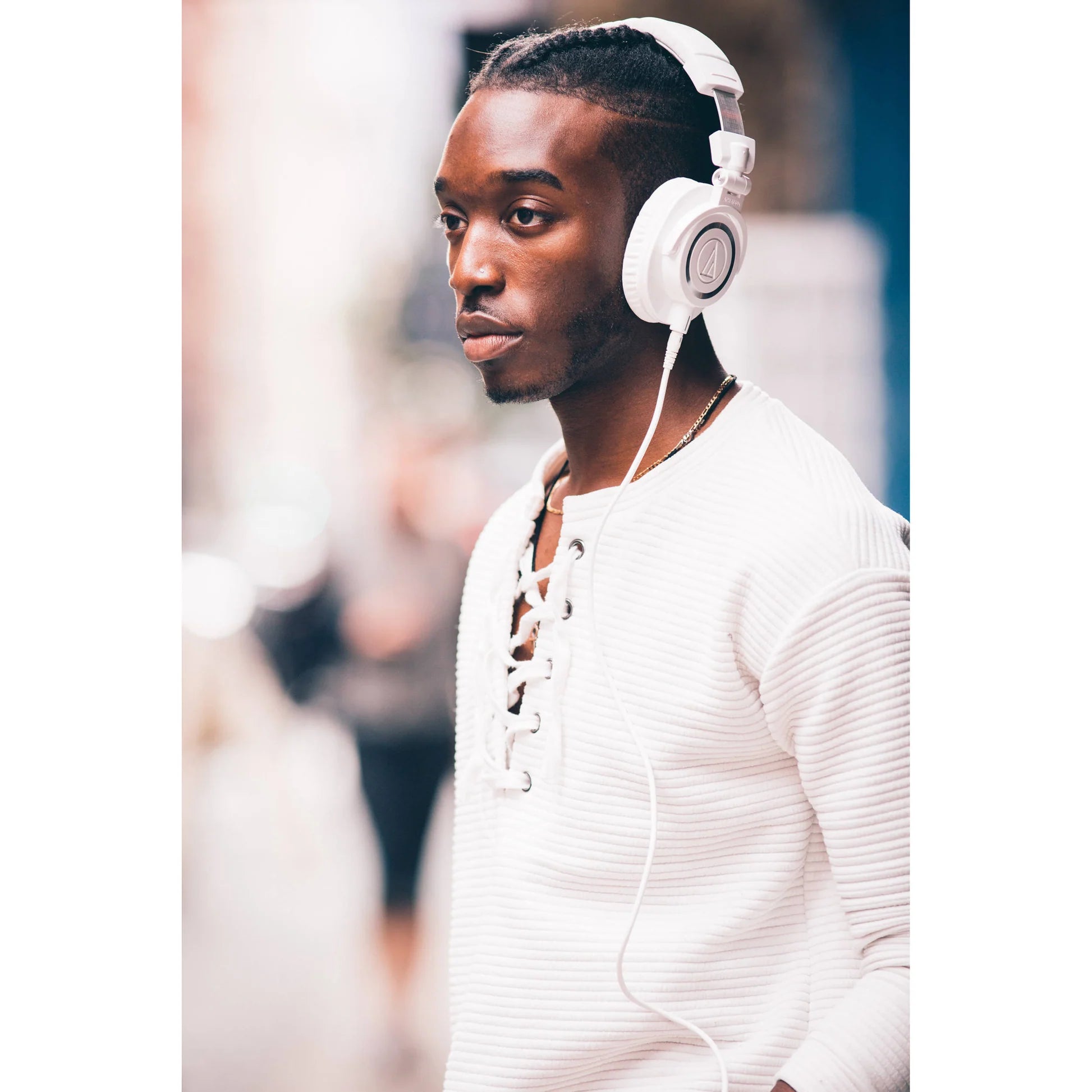 Audio Technica ATH-M50x studio headphones with over-ear design, black color, and padded ear cups for professional listening.