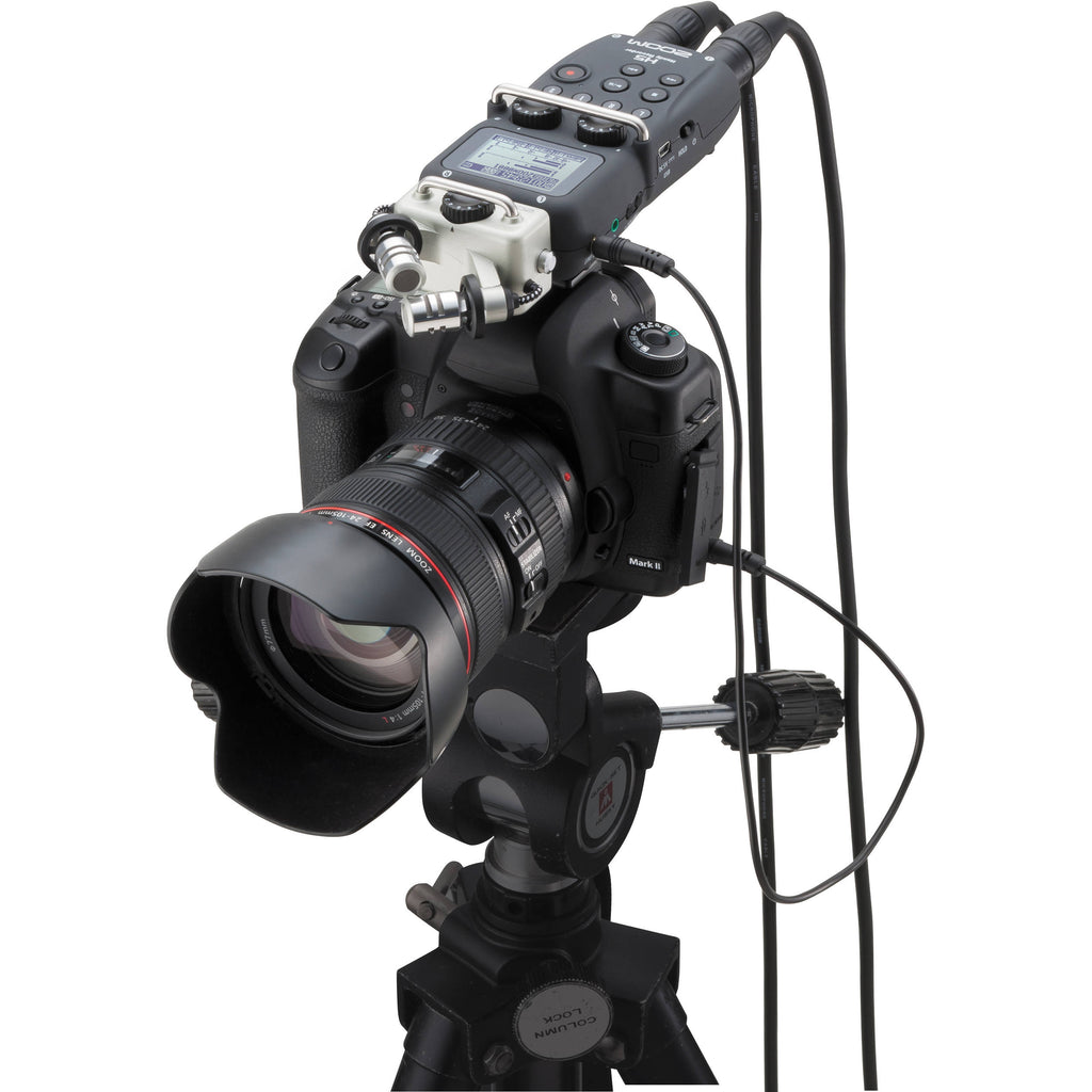 Zoom H5 digital recorder with interchangeable microphone capsules and compact design for high-quality audio recording.