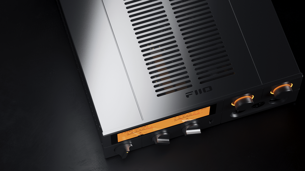 FiiO K17 headphone amplifier and DAC showing front panel with multiple input ports and control knobs.