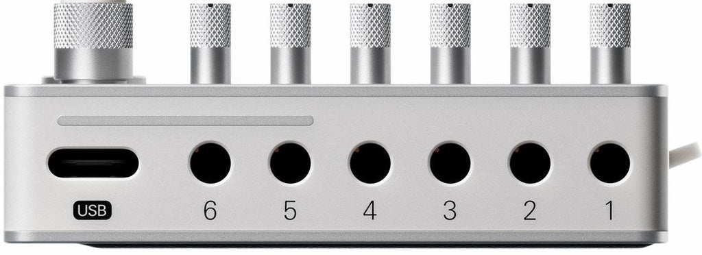 Teenage Engineering TX–6 portable mixer with multiple input channels and colorful control knobs, designed for music and audio mixing.