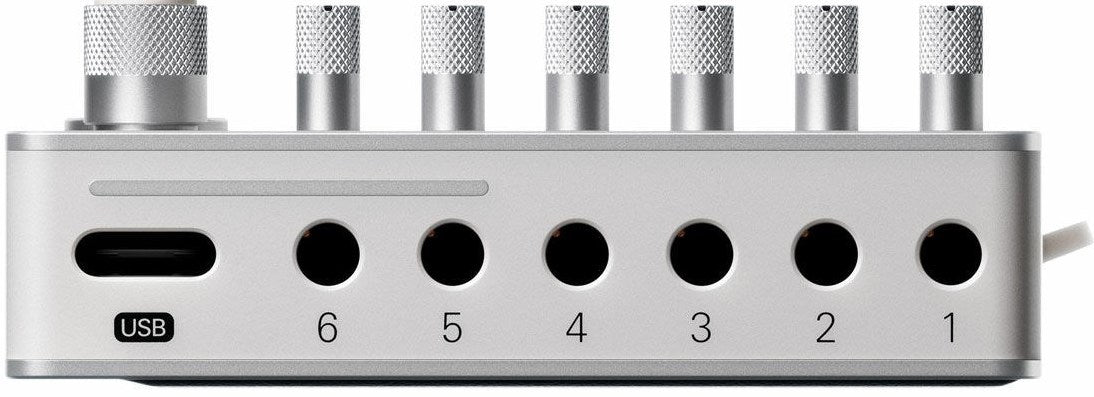Teenage Engineering TX–6 portable mixer with multiple input channels and colorful control knobs, designed for music and audio mixing.