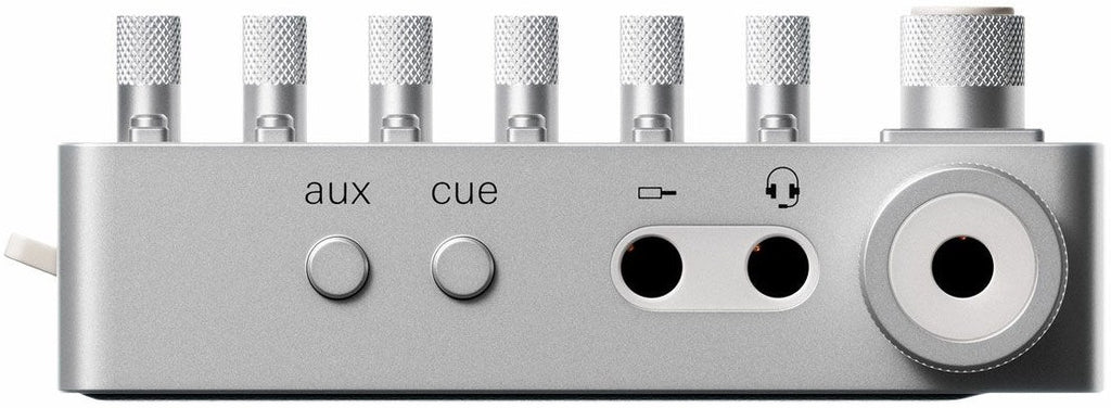 Teenage Engineering TX–6 portable mixer with multiple input channels and colorful control knobs, designed for music and audio mixing.