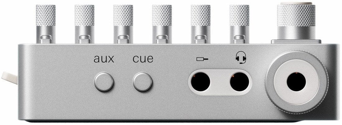 Teenage Engineering TX–6 portable mixer with multiple input channels and colorful control knobs, designed for music and audio mixing.