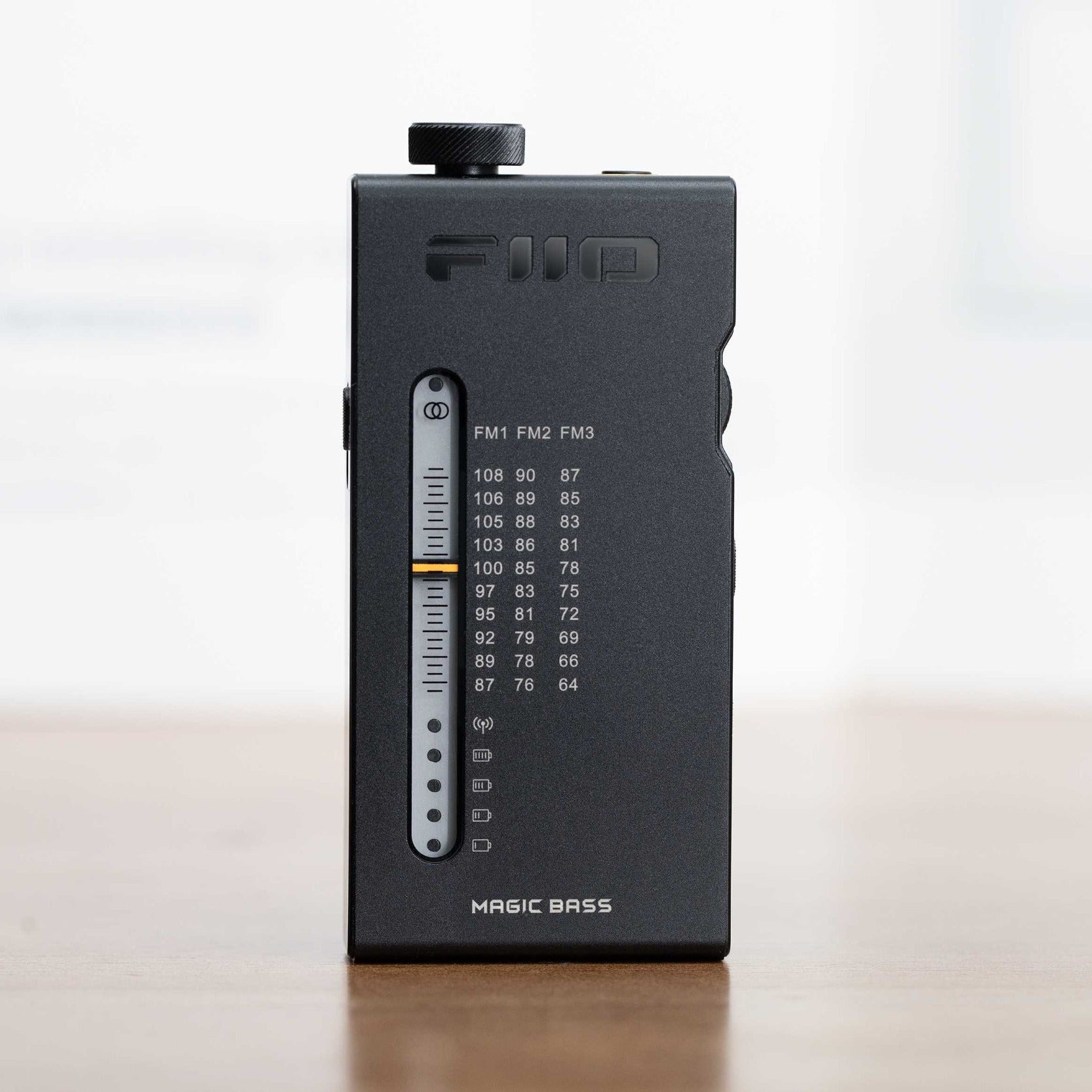 FiiO RR11 radio with a digital display and control buttons, showcasing its sleek design and modern features.