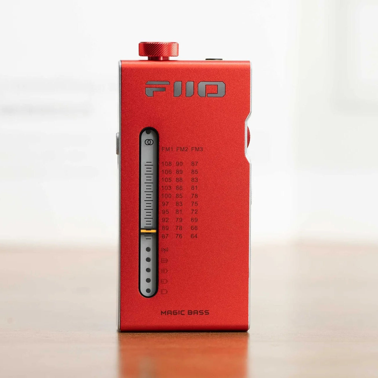 FiiO RR11 radio with digital display, tuning dial, and control buttons on a sleek black design.