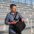 Think Tank Shape Shifter video equipment bag with padded compartments and adjustable shoulder strap, black camera gear case.