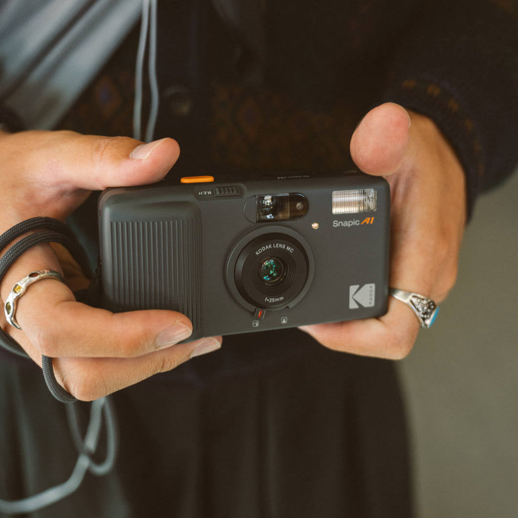 Kodak Snapic A1 instant compact camera with sleek design and LCD screen, ready to capture and print photos instantly.