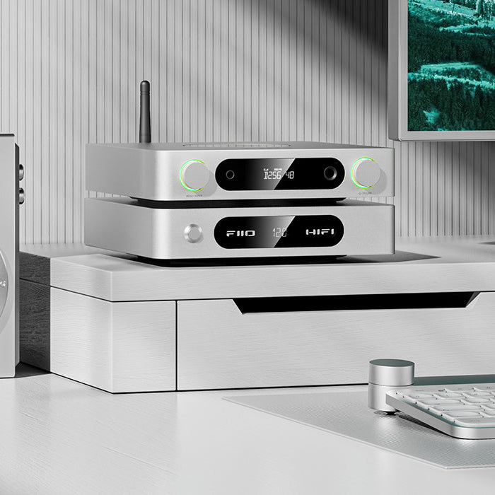 FiiO K13 R2R headphone amplifier and DAC with sleek black finish and multiple input ports for high-quality audio output.