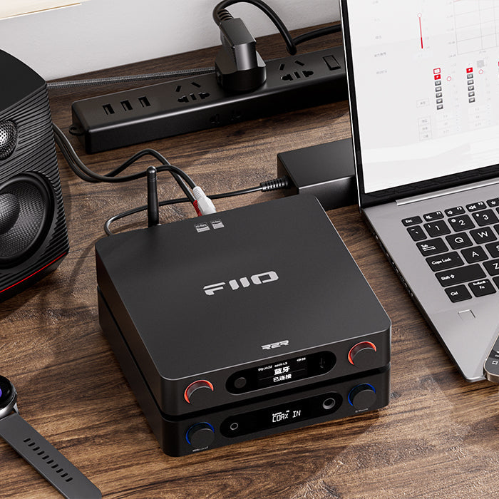 FiiO BR15 R2R music streamer with sleek black design, digital display, and control buttons for high-quality audio streaming.