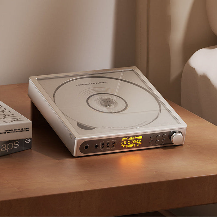 FiiO DM15 R2R CD player with digital display and sleek black finish sitting on a wooden surface.