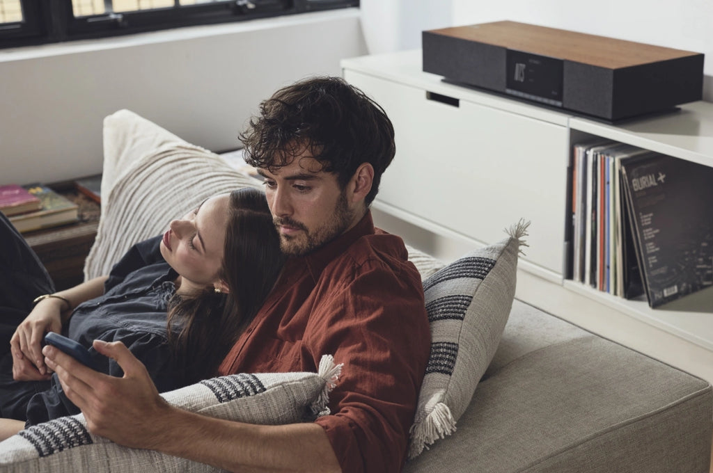 Cambridge Audio Evo One wireless speaker showcasing sleek design and control buttons on a modern audio device.
