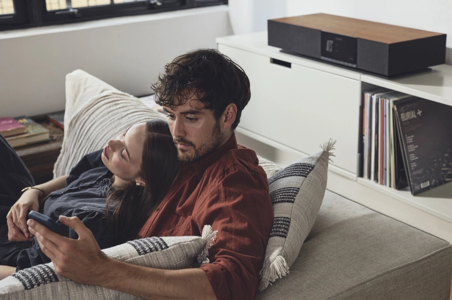 Cambridge Audio Evo One wireless speaker showcasing sleek design and control buttons on a modern audio device.