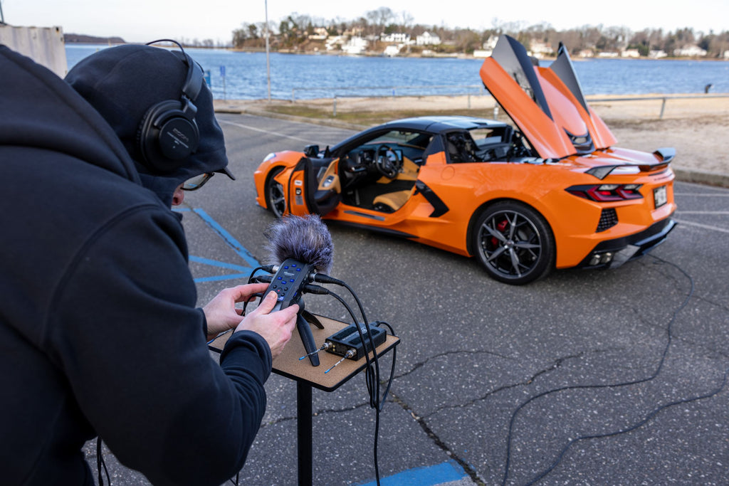 Zoom H6 Essential digital recorder with multiple input options, shown in a lifestyle setup for professional audio recording.