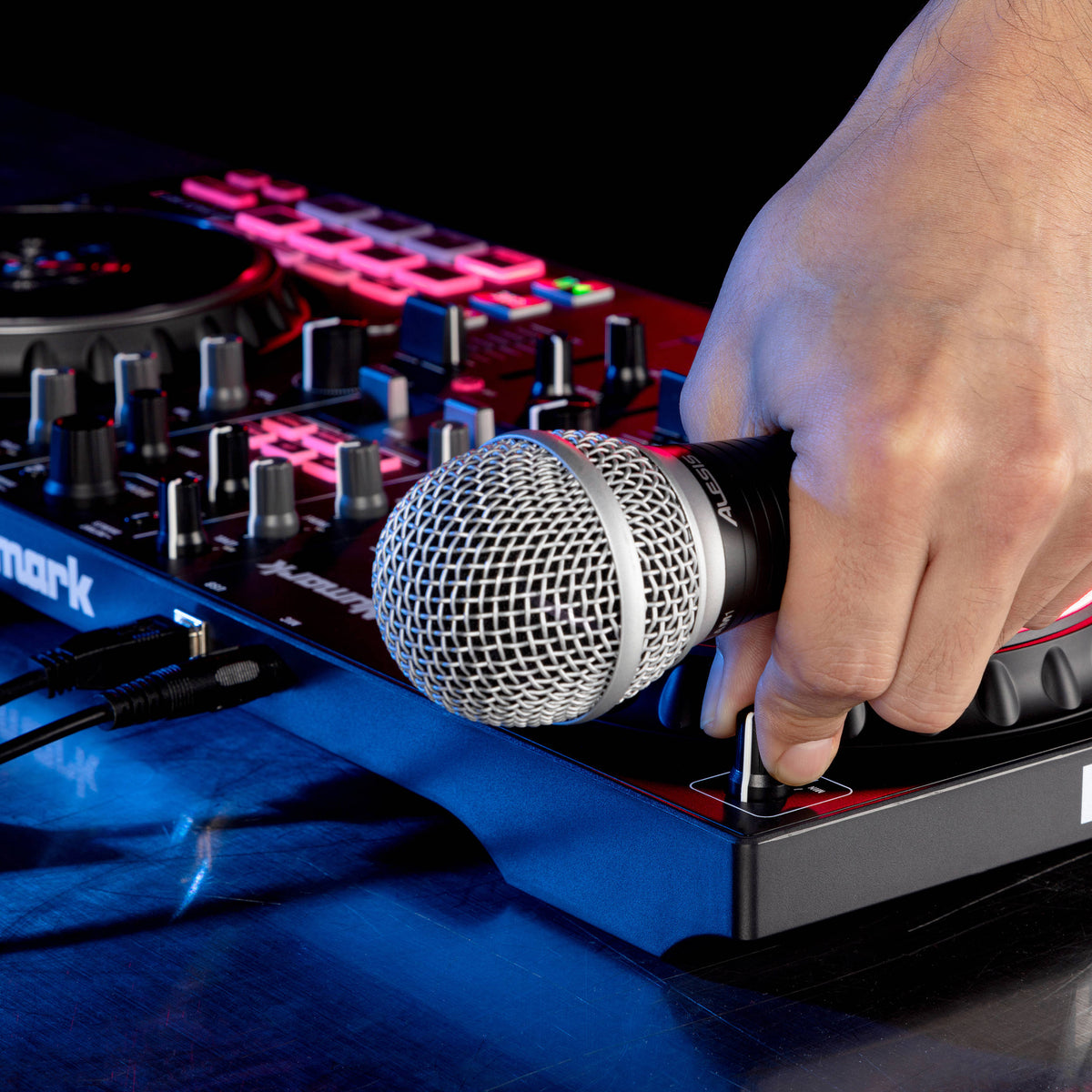 Numark Mixtrack Pro FX DJ controller with jog wheels, control knobs, and performance pads for mixing music.
