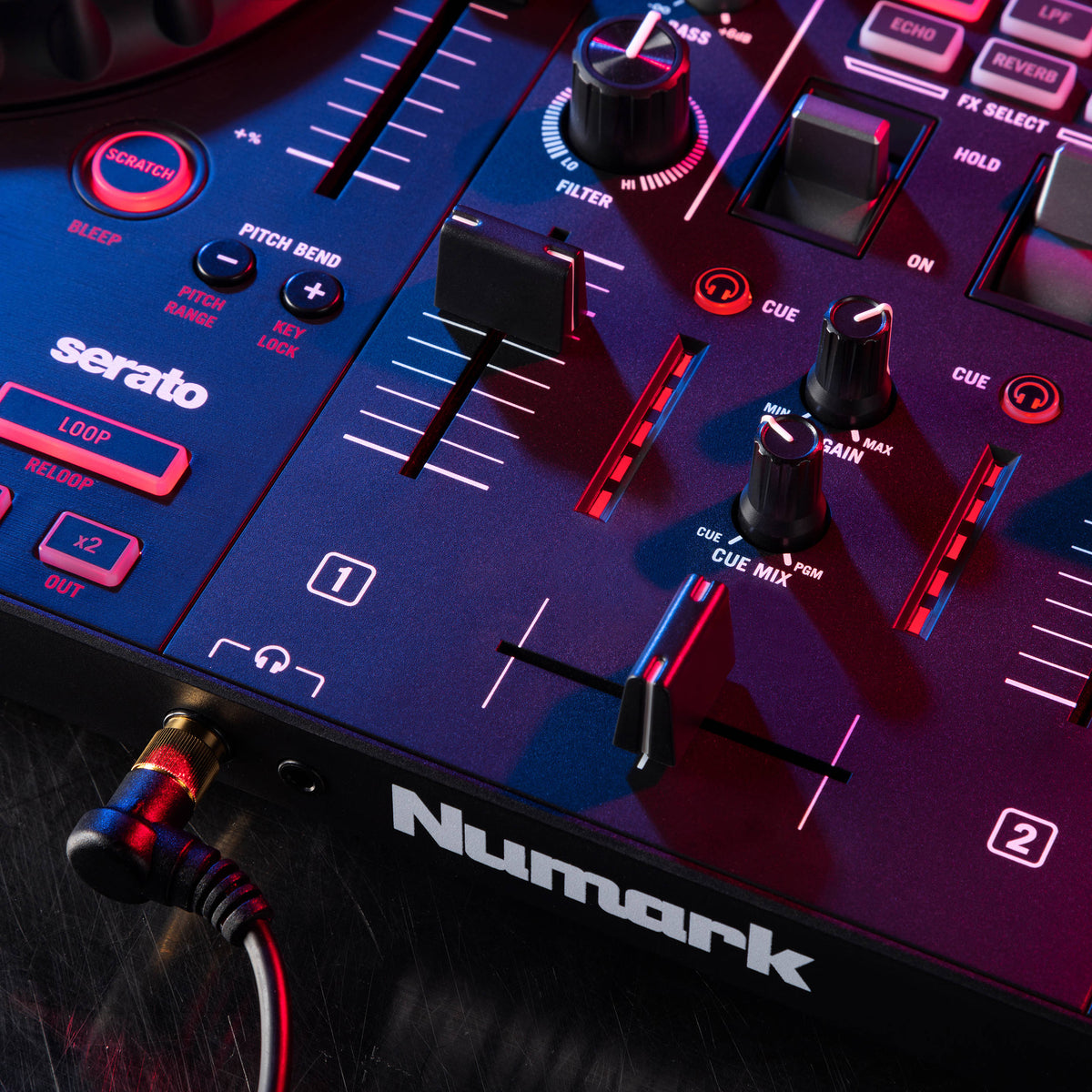 Numark Mixtrack Pro FX DJ controller with dual jog wheels, mixer controls, and colorful performance pads for DJing purposes