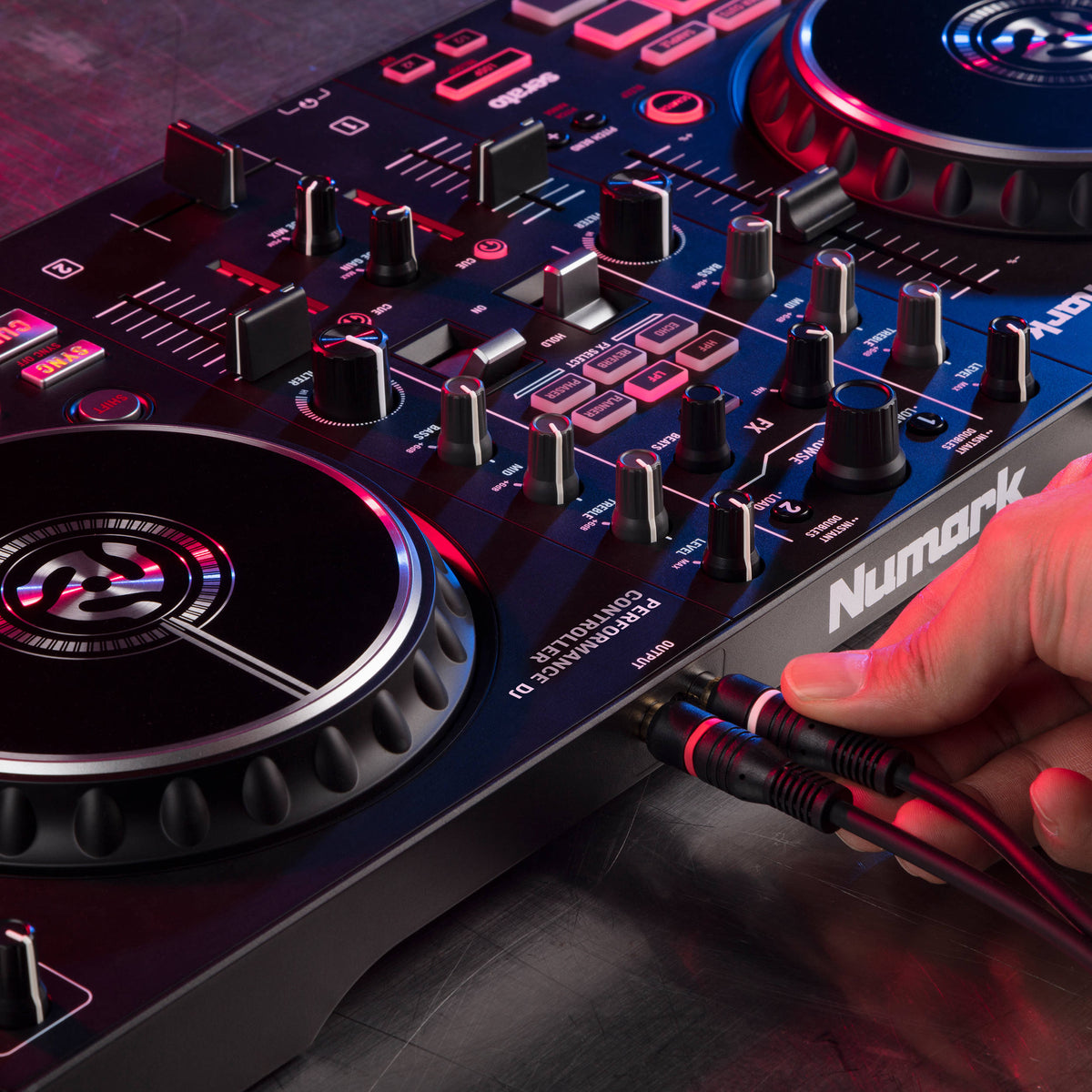 Numark Mixtrack Pro FX DJ controller with jog wheels, faders, and control knobs for mixing music.
