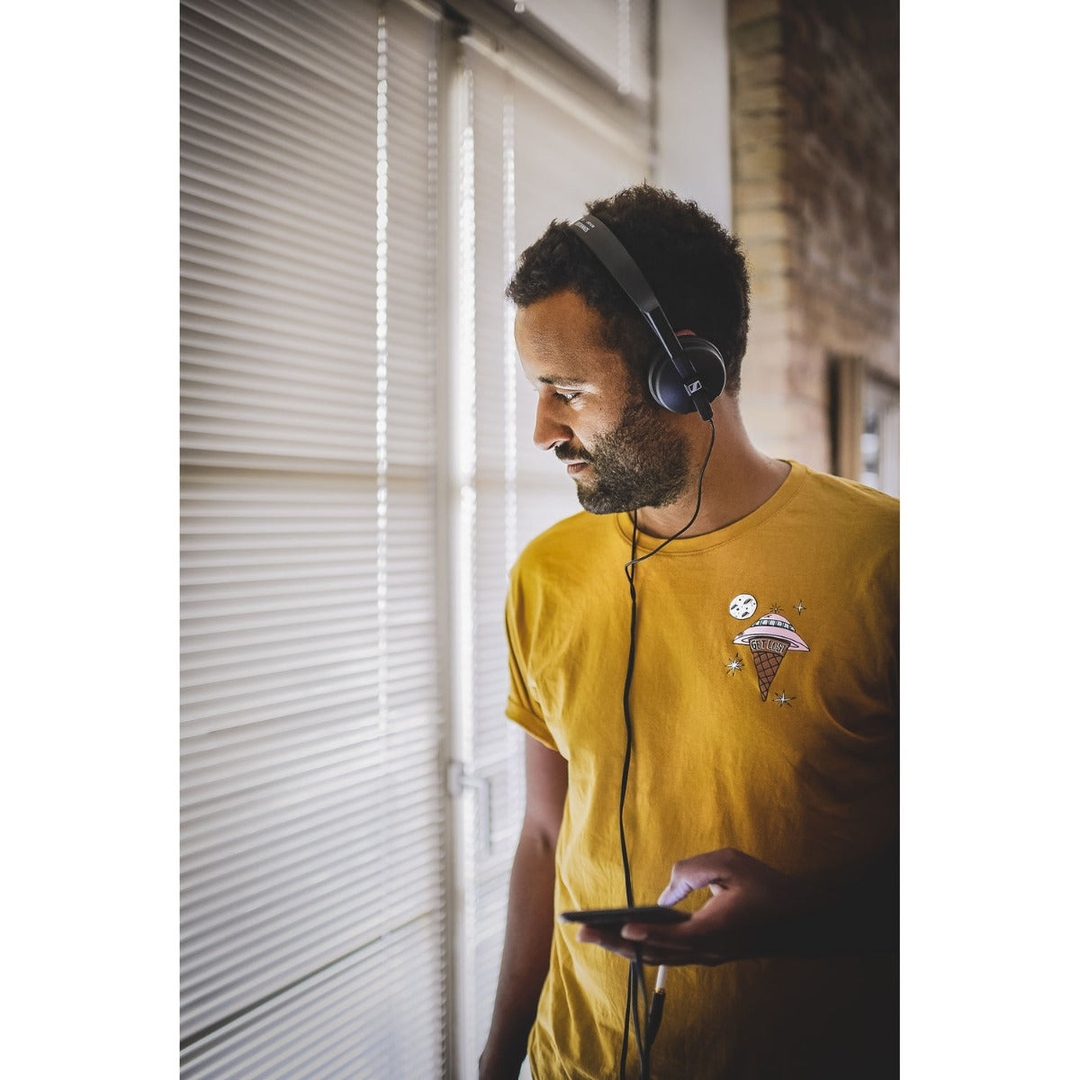 Sennheiser HD 25 Light DJ headphones with over-ear design and adjustable headband, black color, view of ear cups and headband.