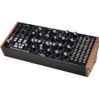Moog Subharmonicon synthesizer with knobs, patch cables, and control panel, showcasing its dual oscillators and vintage design.