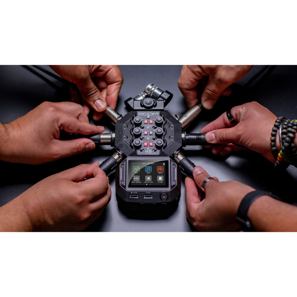 Zoom H8 digital recorder with multiple input modules and colorful display, shown on a white background.