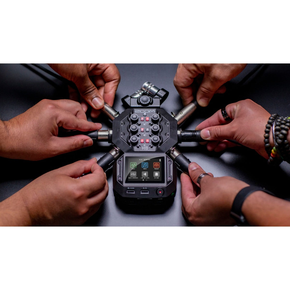 Zoom H8 digital recorder with multiple input modules and colorful display, shown on a white background.