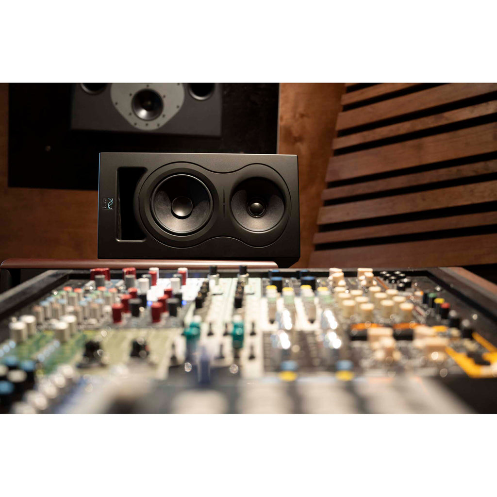 Kali Audio IN-5 active nearfield monitors with sleek black finish and front-facing controls on a studio desk