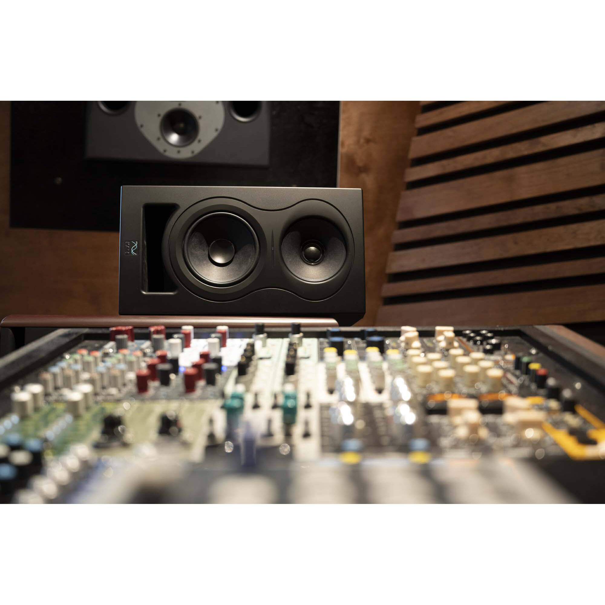 Kali Audio IN-5 active nearfield monitors with sleek black finish and front-facing controls on a studio desk