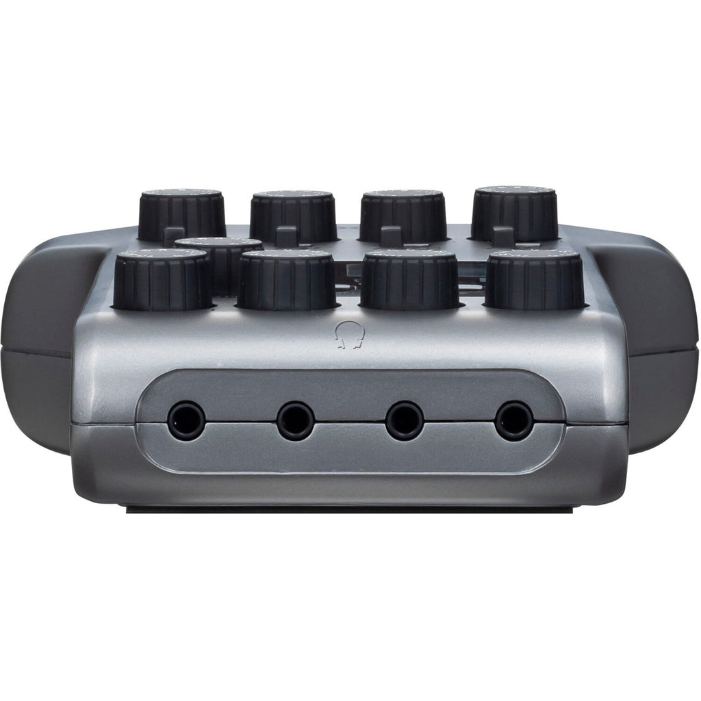 Zoom PodTrak P4 digital recorder with microphone inputs and control buttons, compact portable audio recording device.