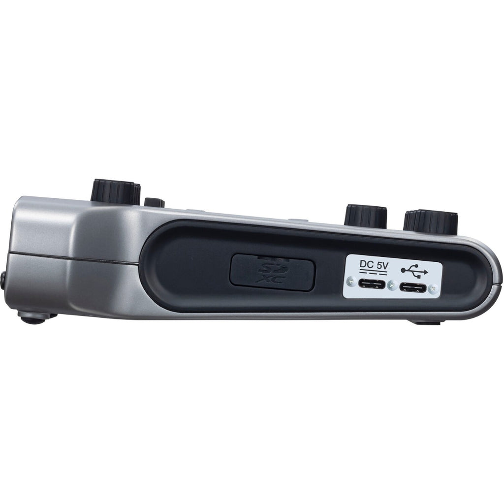 Zoom PodTrak P4 digital recorder with microphone inputs and control buttons, compact portable design.