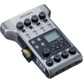 Zoom PodTrak P4 digital recorder with multiple input ports, buttons, and a compact design for portable audio recording.