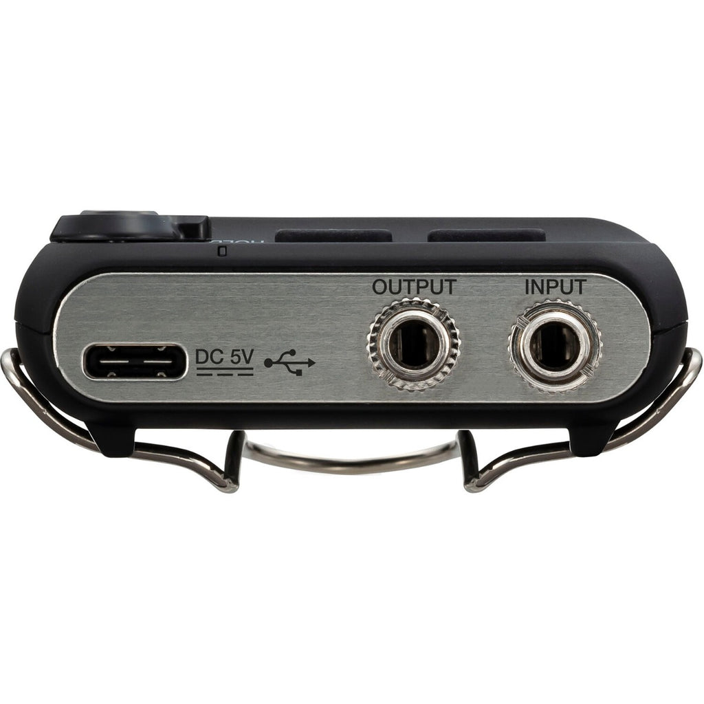 Zoom F2-BT digital recorder with compact design, featuring multiple input ports and a built-in microphone for high-quality audio recording.