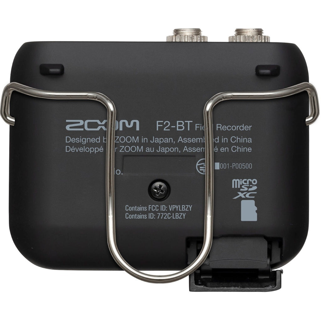 Zoom F2-BT digital recorder with compact design, featuring multiple input ports and built-in microphone for high-quality audio recording.