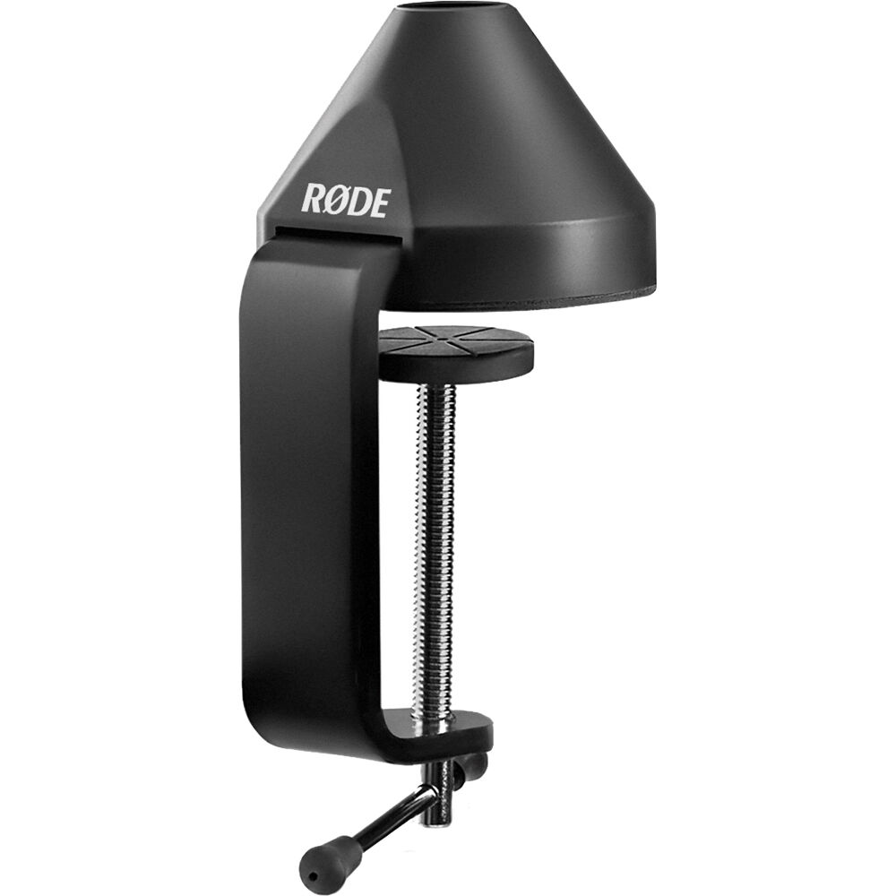 Rode PSA1+ broadcast microphone arm mounted on a desk, adjustable arm for professional audio recording and streaming.