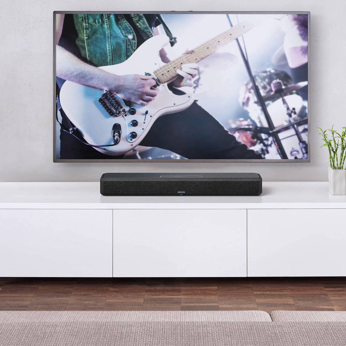 Denon Home Soundbar 550 with sleek black design and multiple speaker drivers for enhanced TV sound quality.