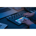 Novation Circuit Tracks sequencer with grid controller and buttons, black device for music production and beat making.