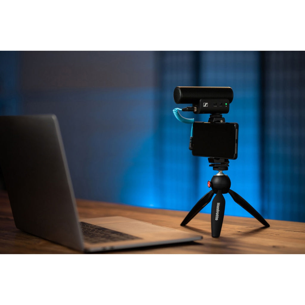 Sennheiser MKE 400 MK2 camera microphone mounted on a camera, showing compact design and built-in shock mount for clear audio recording.