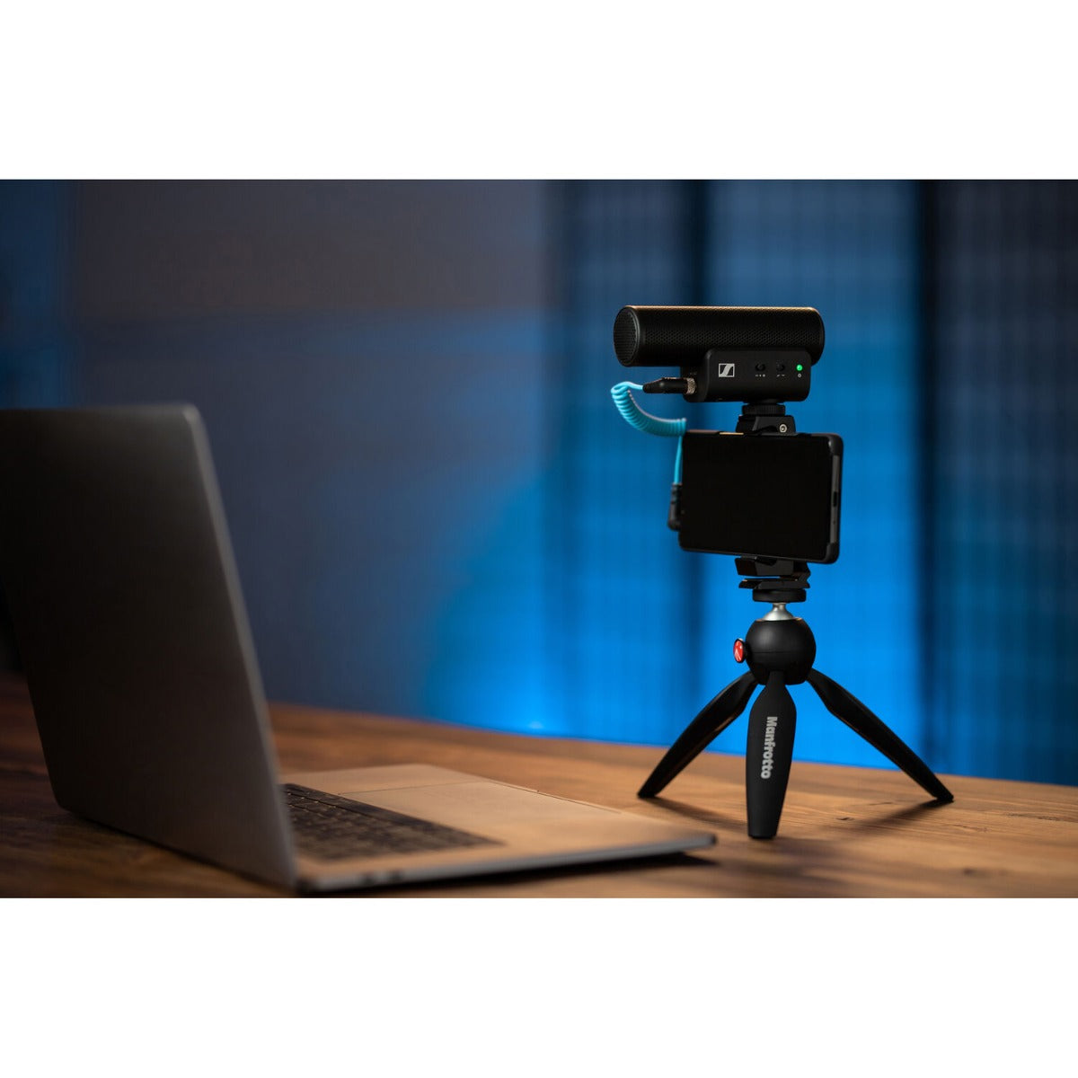 Sennheiser MKE 400 MK2 camera microphone mounted on a camera, showing compact design and built-in shock mount for clear audio recording.