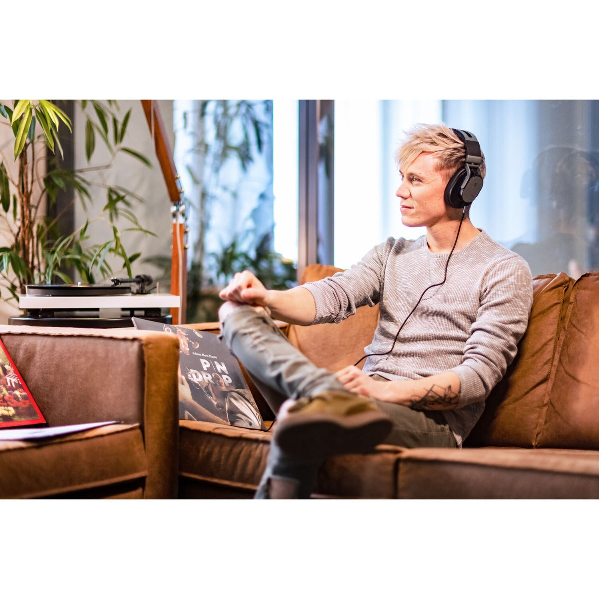 Austrian Audio Hi-X65 studio headphones with over-ear design, black ear cups, and adjustable headband for professional audio listening.