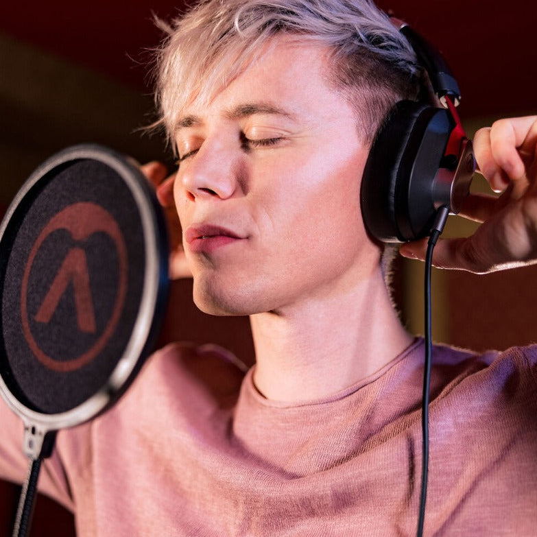 Austrian Audio Hi-X15 studio headphones with over-ear design and black cushioning, featuring adjustable headband and branded ear cups.